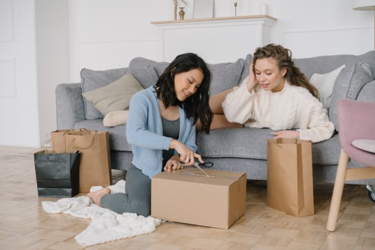 girls excitedly opening packages of free and cheap car accessories
