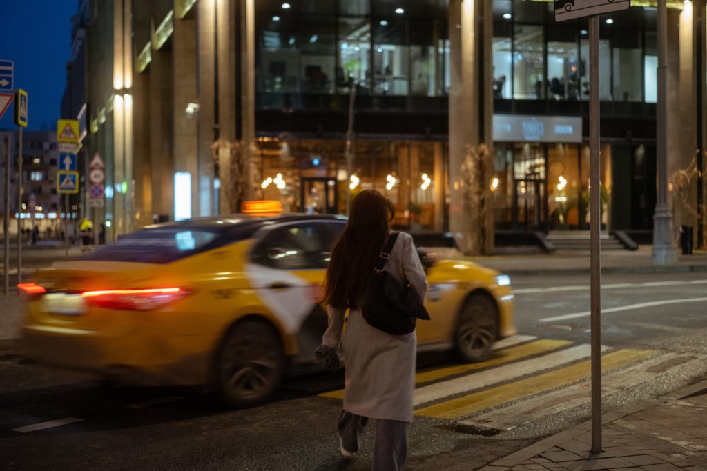 girl waiting for taxi -- uber safety tips
