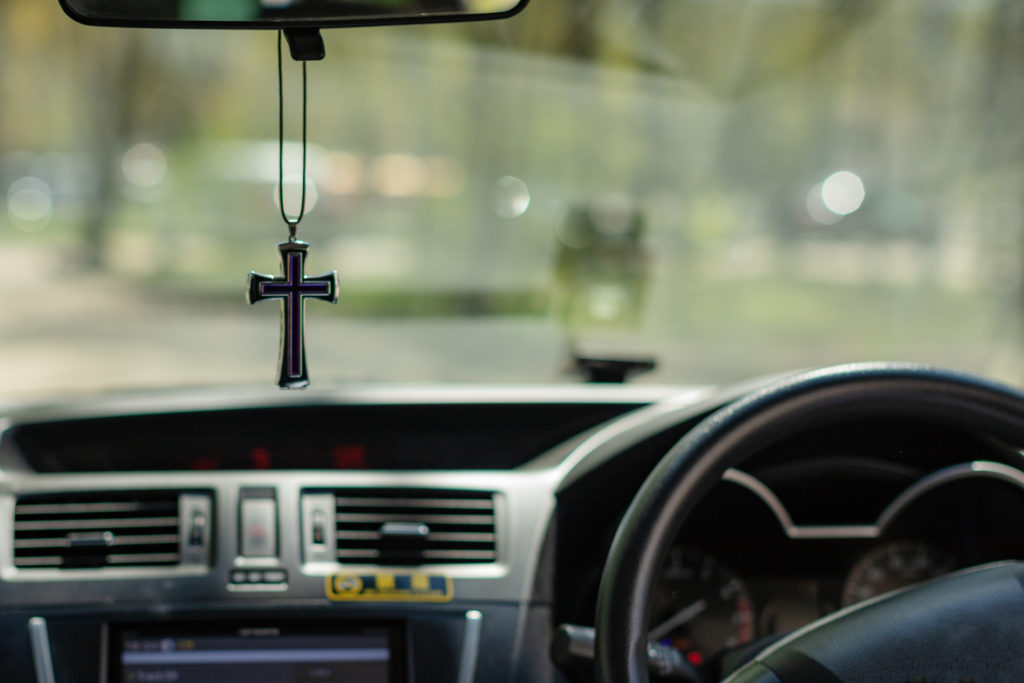 Cross hanging from rear view mirror - Prayers for driving