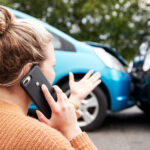 lady on the phone wondering what to do after a car accident