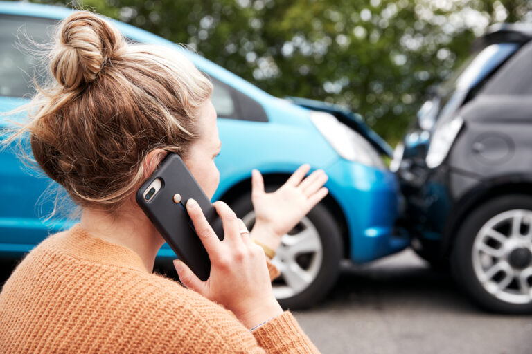 lady on the phone wondering what to do after a car accident